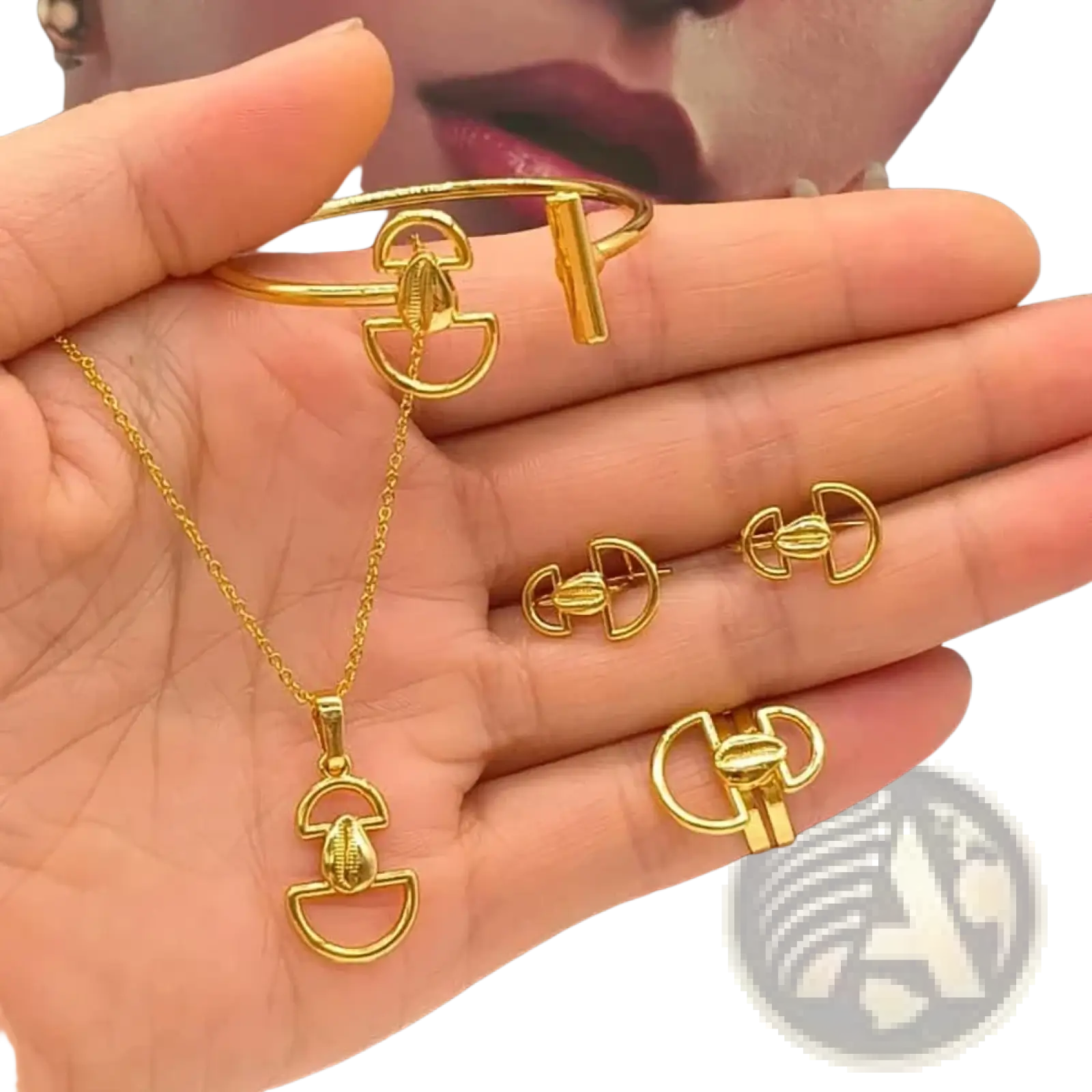 Gold fan shape jewelry set 18k plated featuring gold-toned metal horsebit design on bracelet necklace earrings and ring