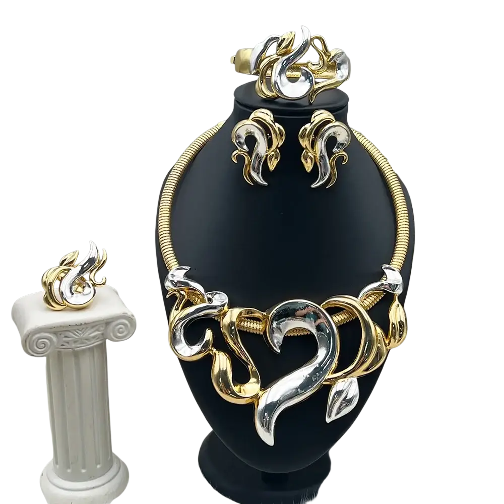 Gold and silver two-tone flame designed jewelry set with intricate swirling patterns on a black display stand for women wedding party