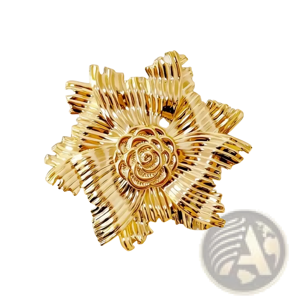 Gold flower brooch with pearl accent featuring intricate layered metallic petals and a detailed rose center