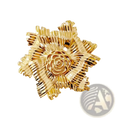 Gold flower brooch with pearl accent featuring intricate layered metallic petals and a detailed rose center