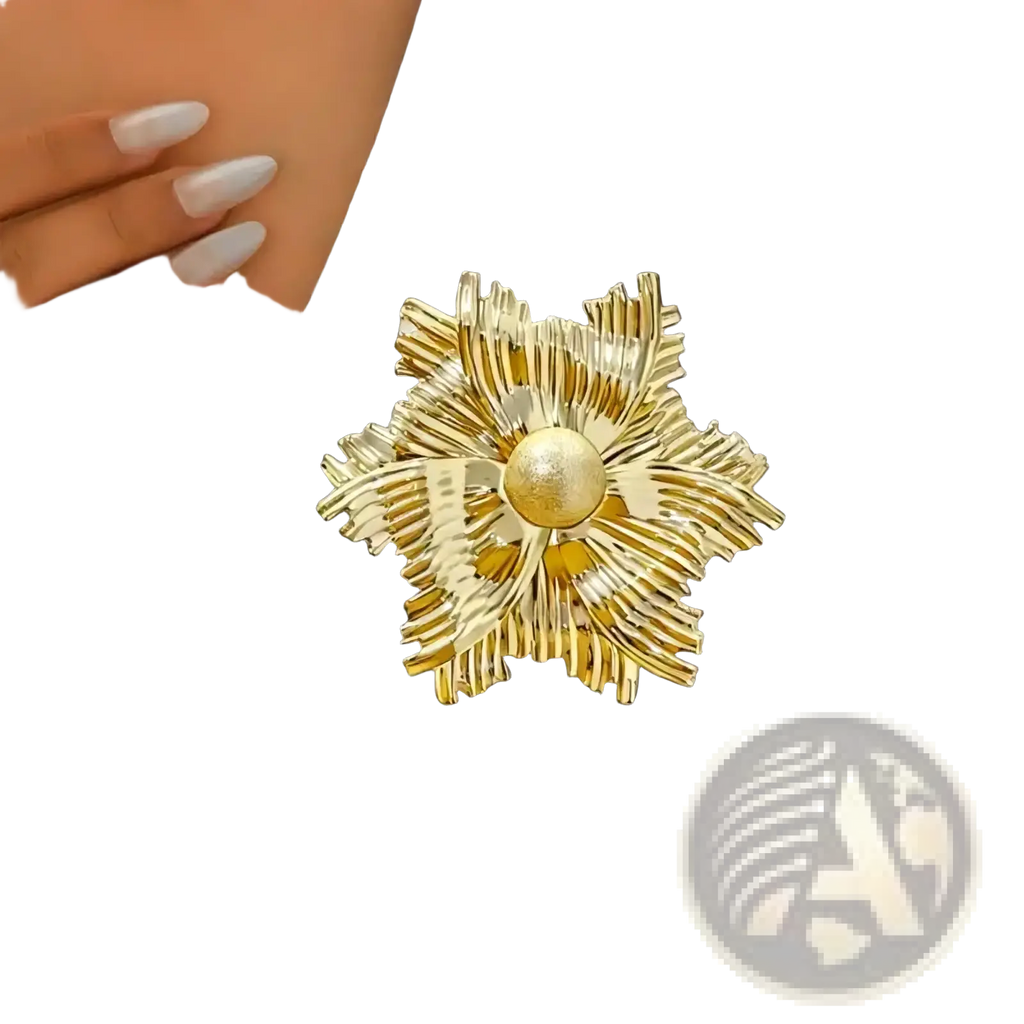 Gold flower brooch with pearl accent featuring gold-toned metallic textured petals radiating from the center