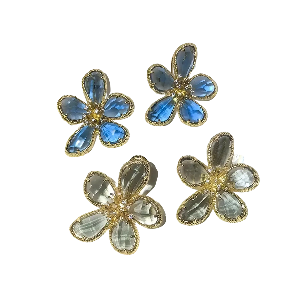 Blue and clear crystal flower-shaped stud earrings with gold-tone metal settings for elegant wear