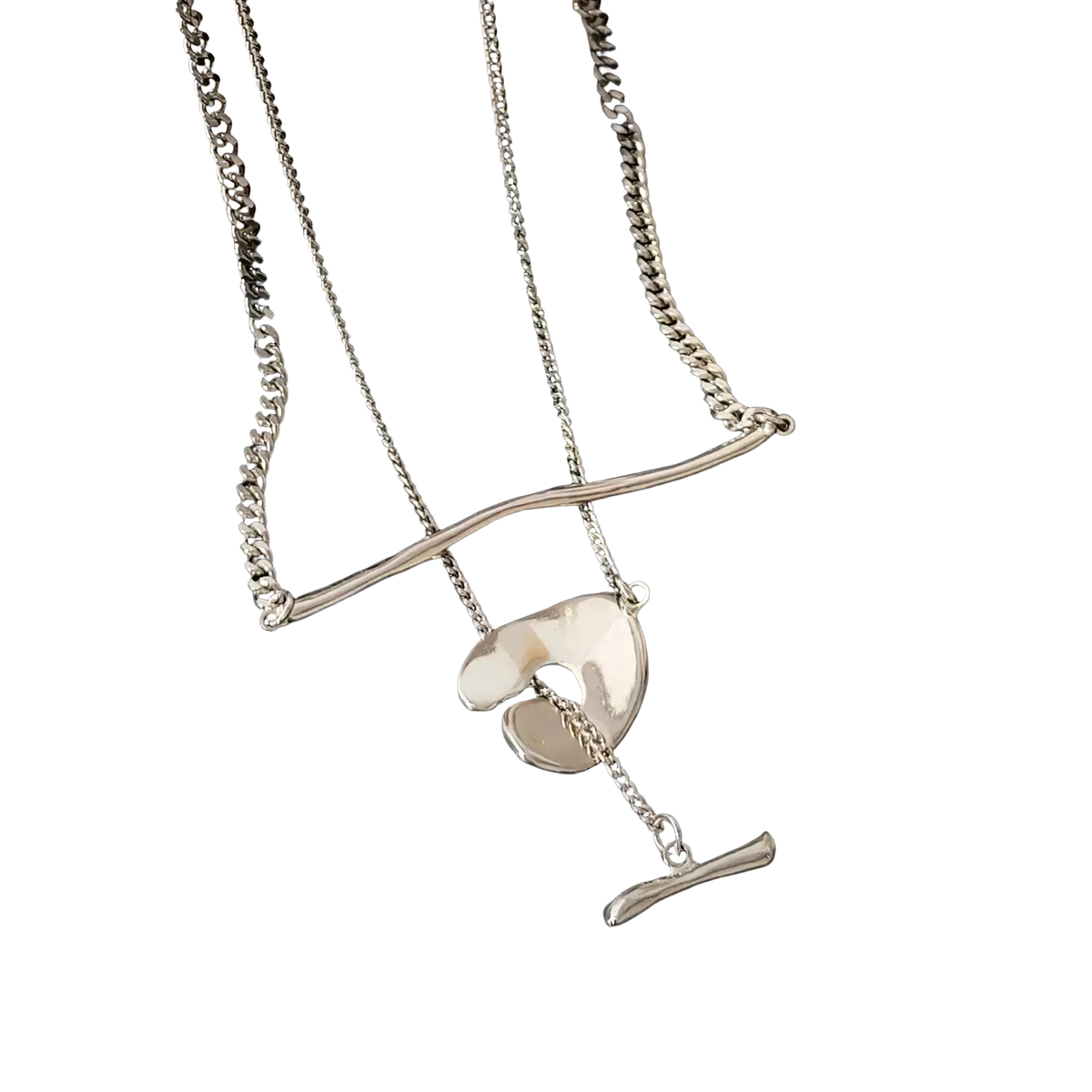 Silver-toned layered pendant necklace for women with curved bar, abstract shell pendant, and small t-bar charm