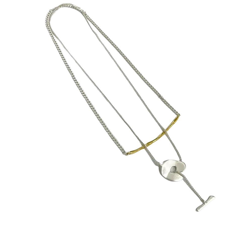 Gold geometric layered pendant necklace for women featuring silver and gold-toned circular pendant with t-bar clasp