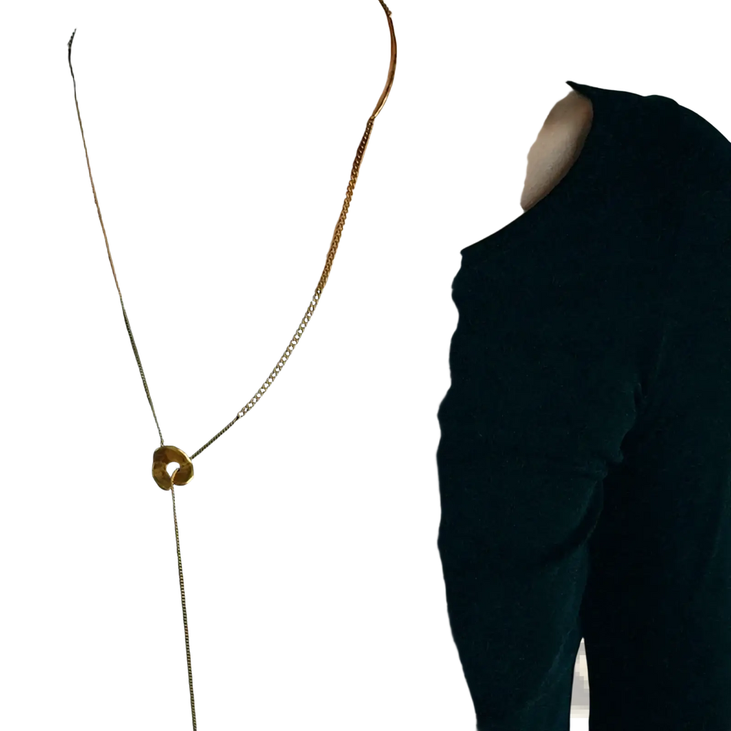 Gold geometric layered pendant necklace for women featuring a gold-toned chain and circular open center pendant