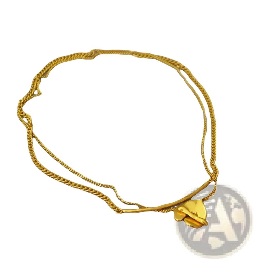 Gold-toned double-strand chain bracelet with delicate heart-shaped pendant complementing gold geometric layered necklace women