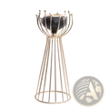 Gold geometric wire cage candle holder with gold-toned metal and sleek black ceramic base with decorative spheres