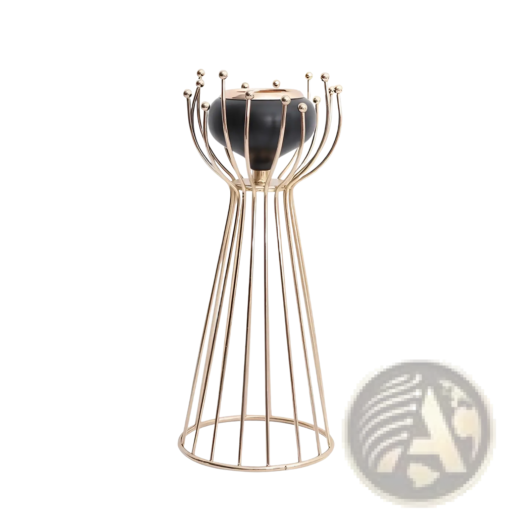 Gold geometric wire cage candle holder with gold-toned metal and black ceramic base featuring spherical finials