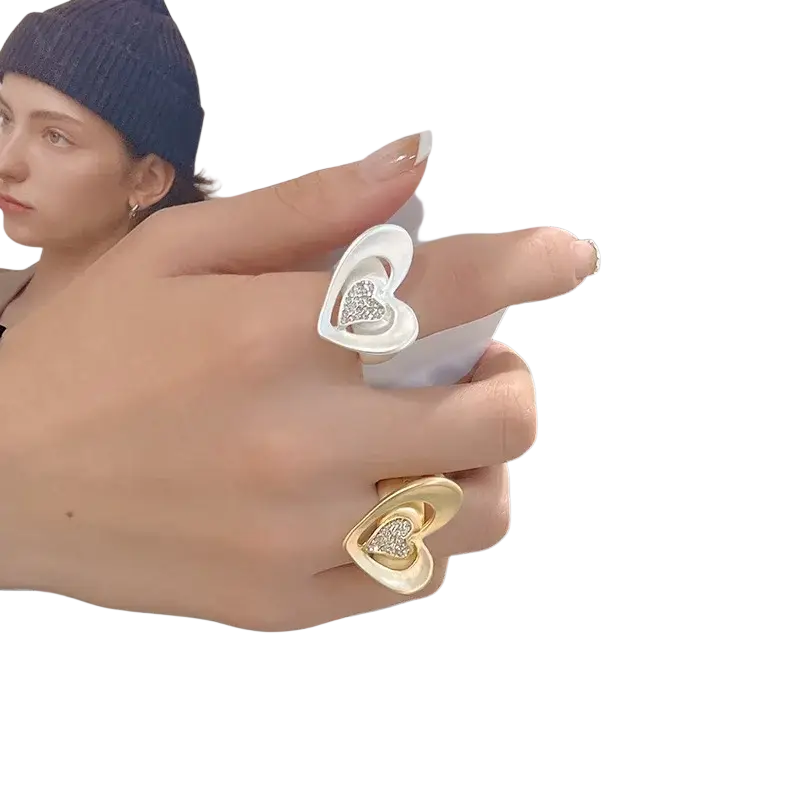 Two adjustable heart-shaped rings in white and gold featuring diamond-encrusted heart designs rhinestone ring