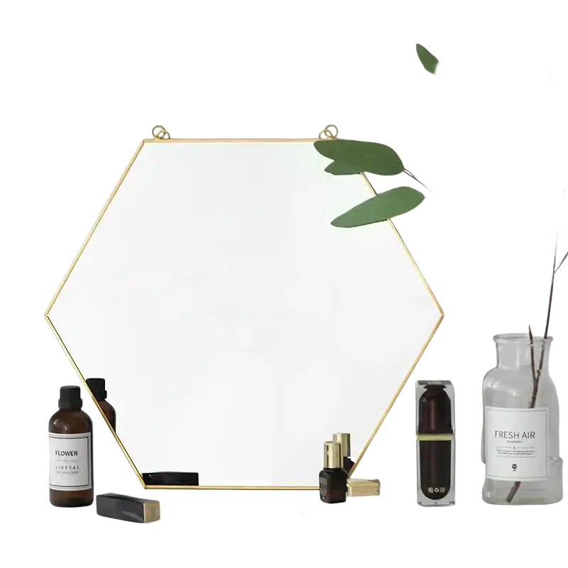 Gold hexagonal wall hanging mirror with a thin gold metal frame suitable for modern interior decor