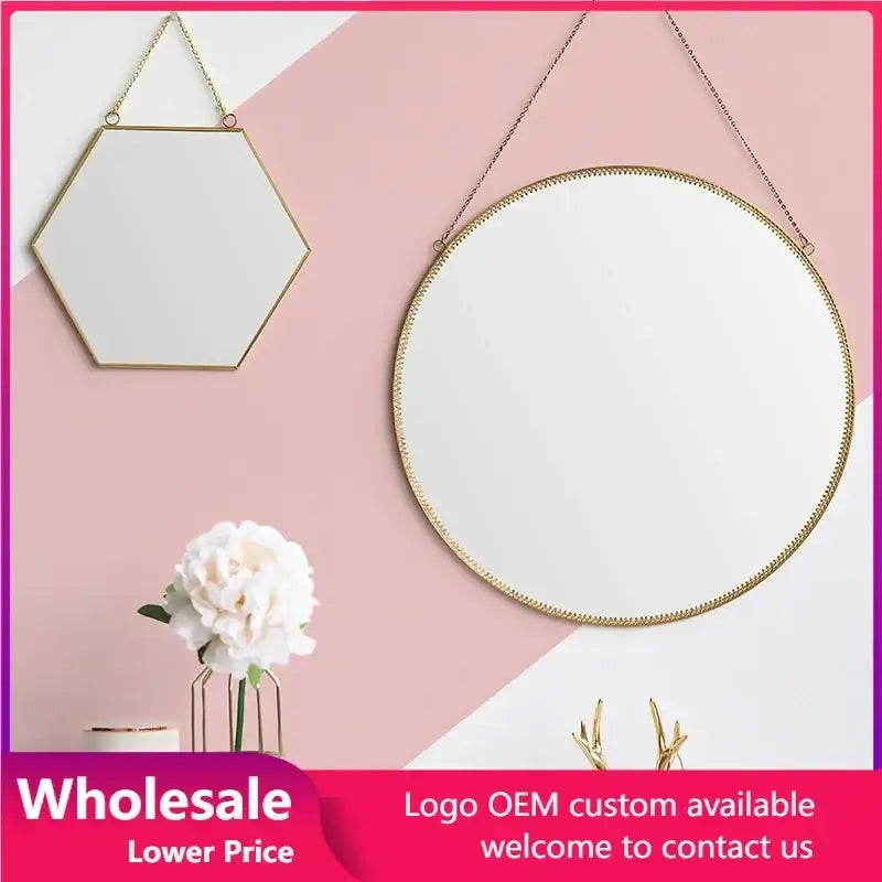 Gold hexagonal wall hanging mirror with gold-framed hexagonal and circular shapes and chain hanging straps