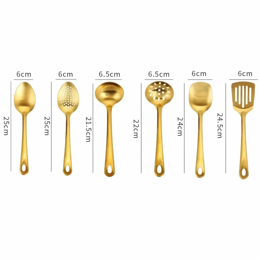 Set of six gold kitchen utensils made of stainless steel including spoons, ladles, spatula, and perforated tools