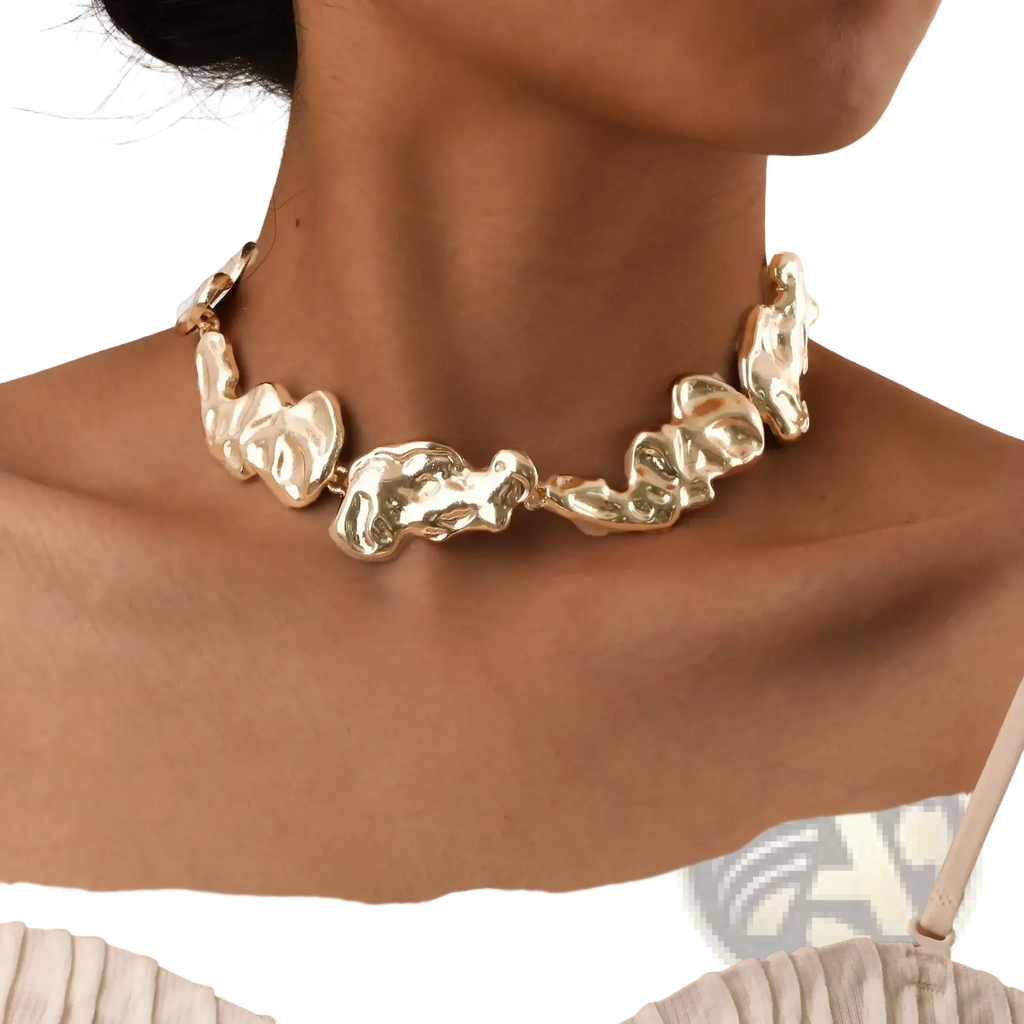 Gold lava choker necklace featuring gold-toned textured sculptural links with an organic minimalist design