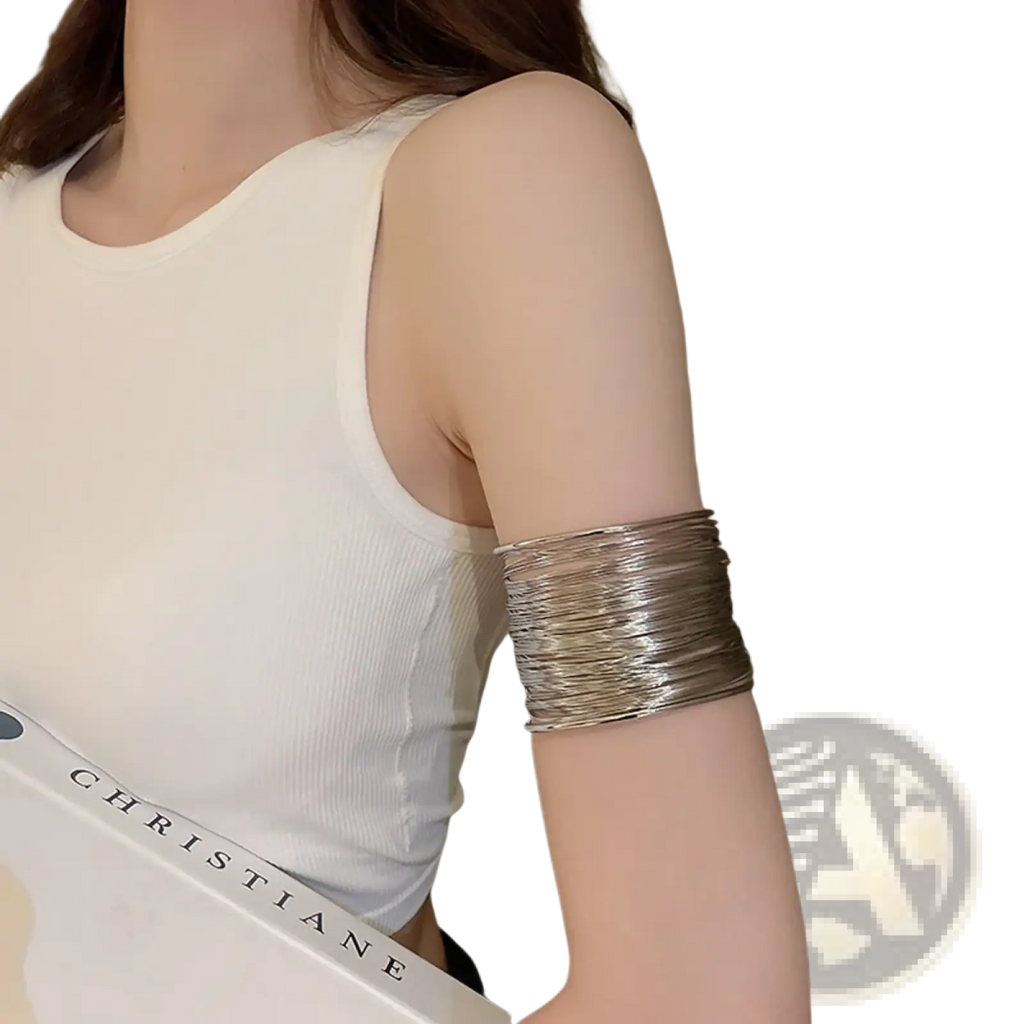 Silver metallic bangle cuff bracelet with stacked layered design worn on arm from gold layered wire cuff collection