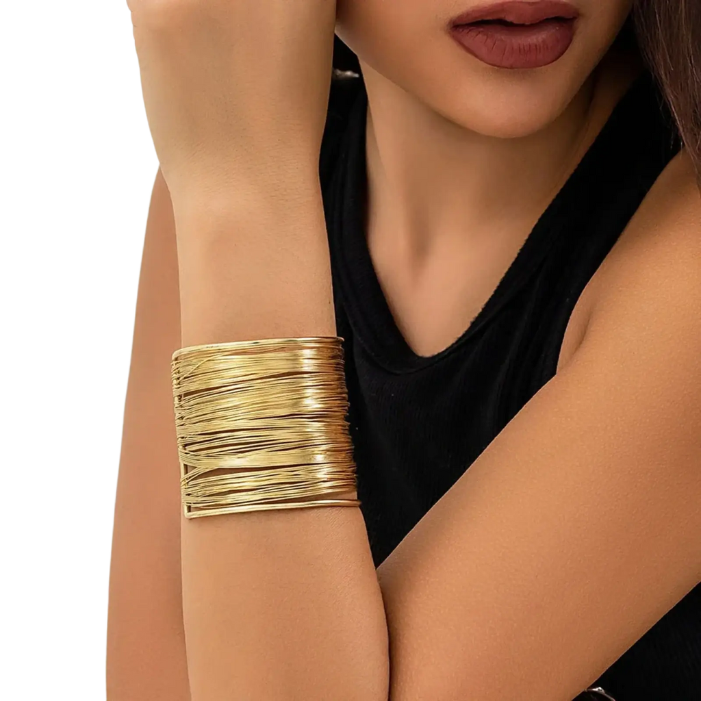Gold layered wire cuff bracelet featuring a bold stacked design in gold tone for elegant wristwear