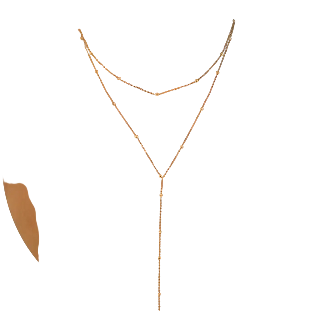Gold layered y necklace for women with a delicate gold-toned v-shaped design and small spherical beads along chains