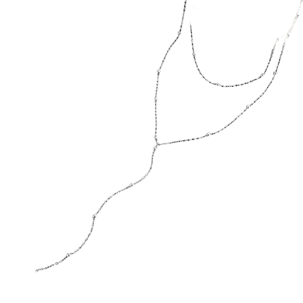 Silver chain necklace with delicate beaded accents complementing a gold layered y necklace for women