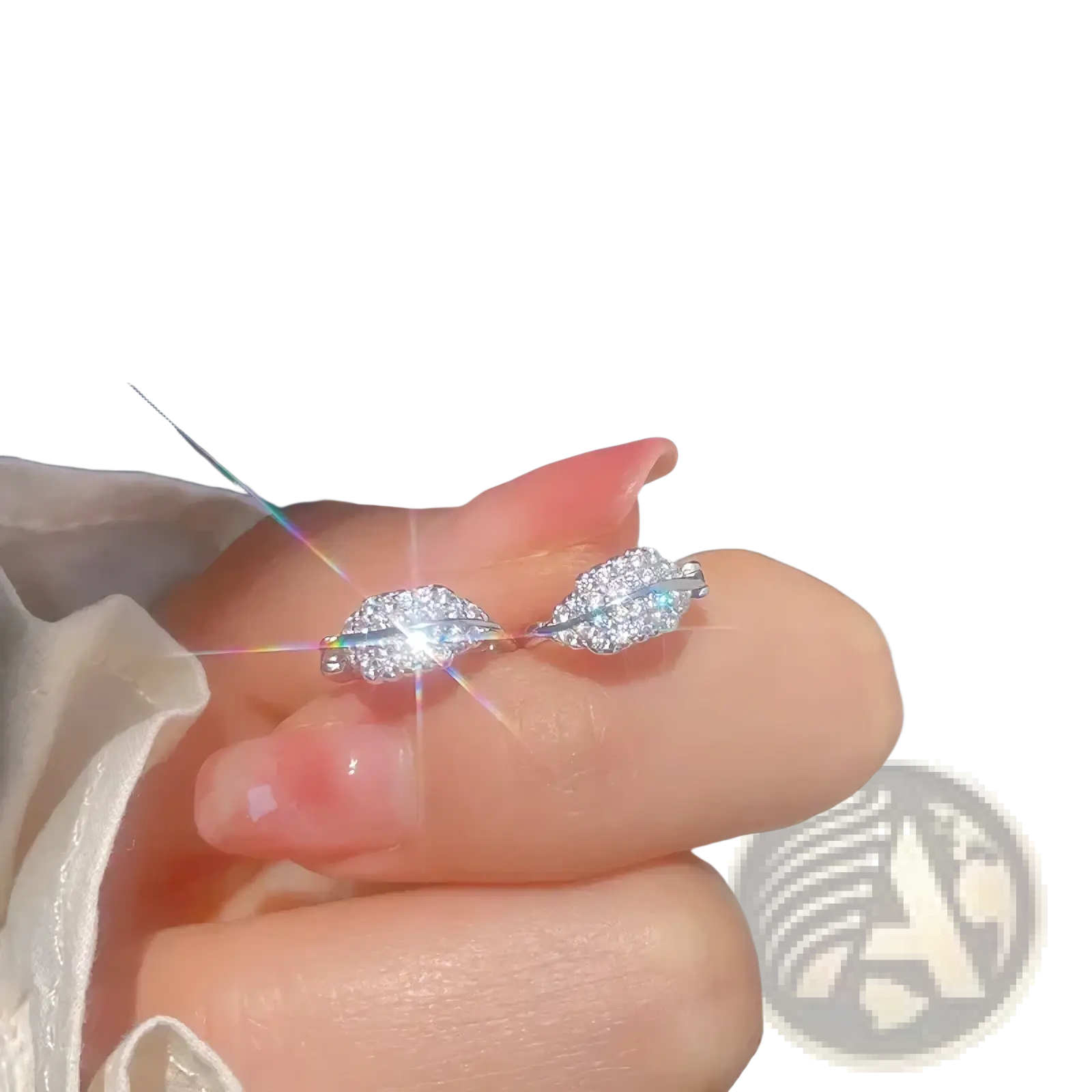 A delicate silver ring with two interlocking leaf-shaped designs adorned with clear crystals in stainless steel