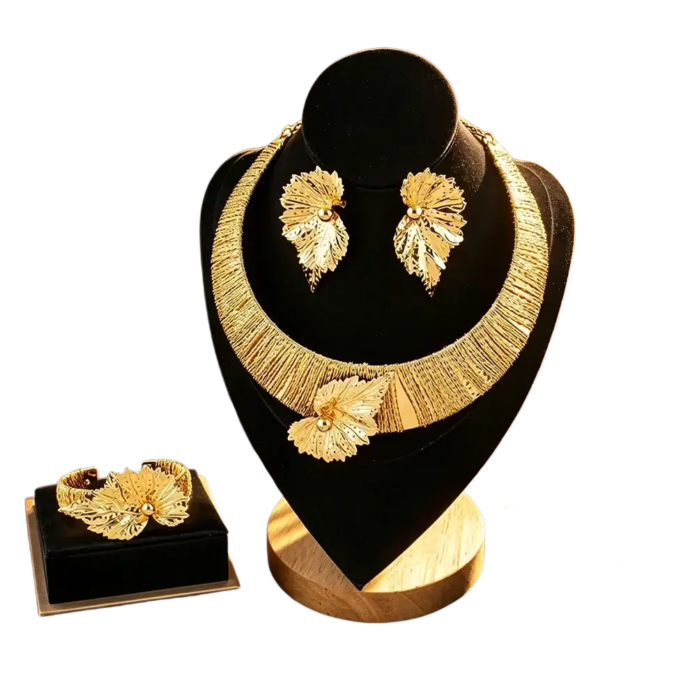 Gold leaf pearl jewelry set featuring gold filigree detailing with central pearl accents on each piece