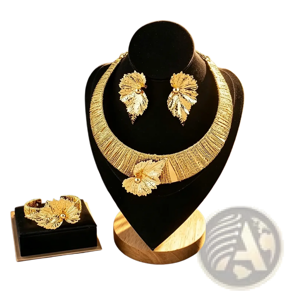 Gold leaf pearl jewelry set featuring gold filigree detailing with central pearl accents on each piece