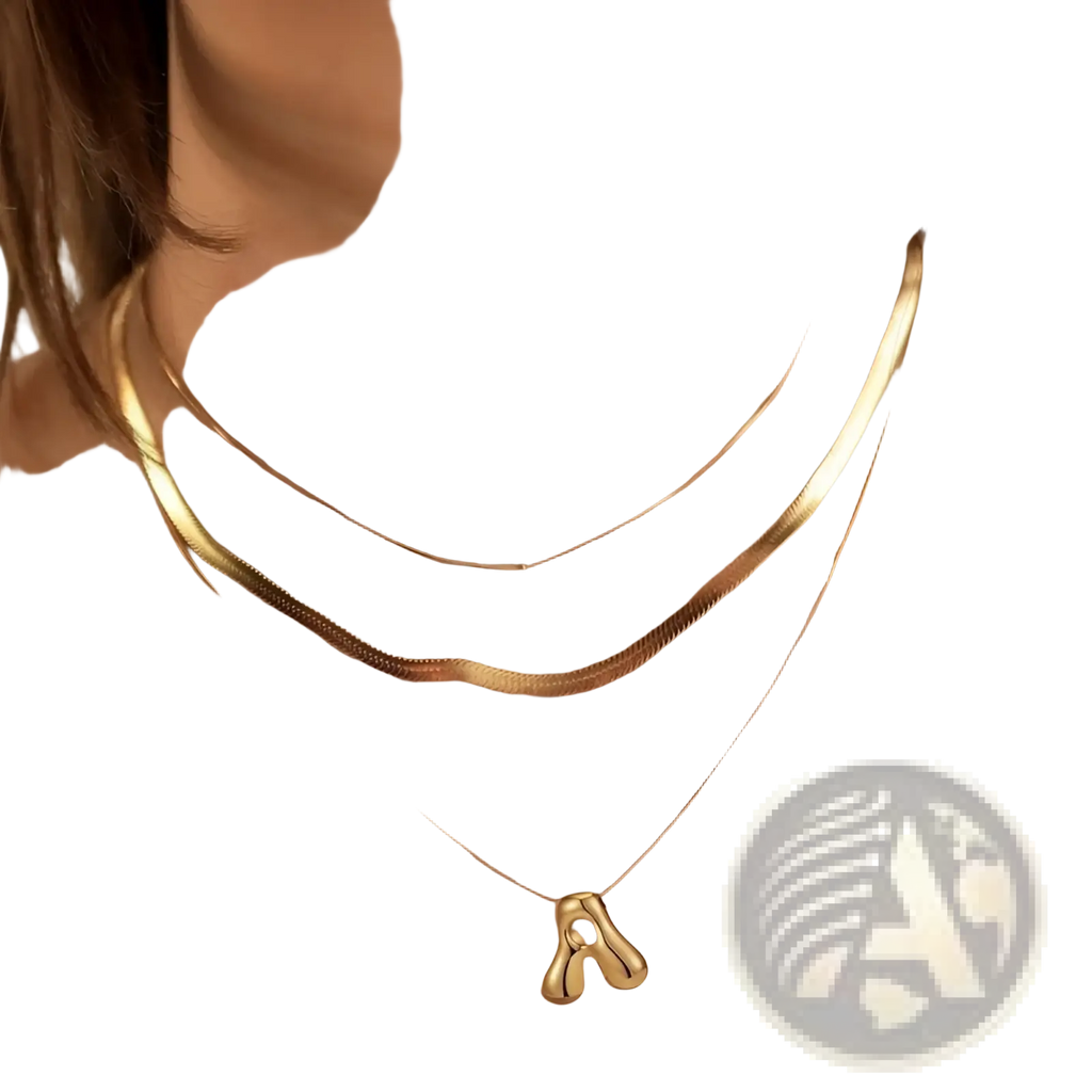 Gold toned layered snake chain necklace with smooth cable chain and minimalist letter a pendant in sleek design