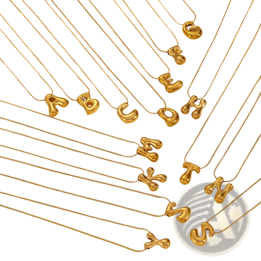 Gold-colored balloon-shaped letter necklaces on delicate layered snake chains made of fine metal