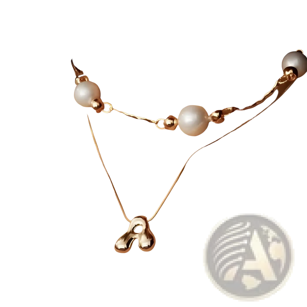Gold letter a layered snake chain necklace with a delicate gold-toned twisted chain and three large white pearls