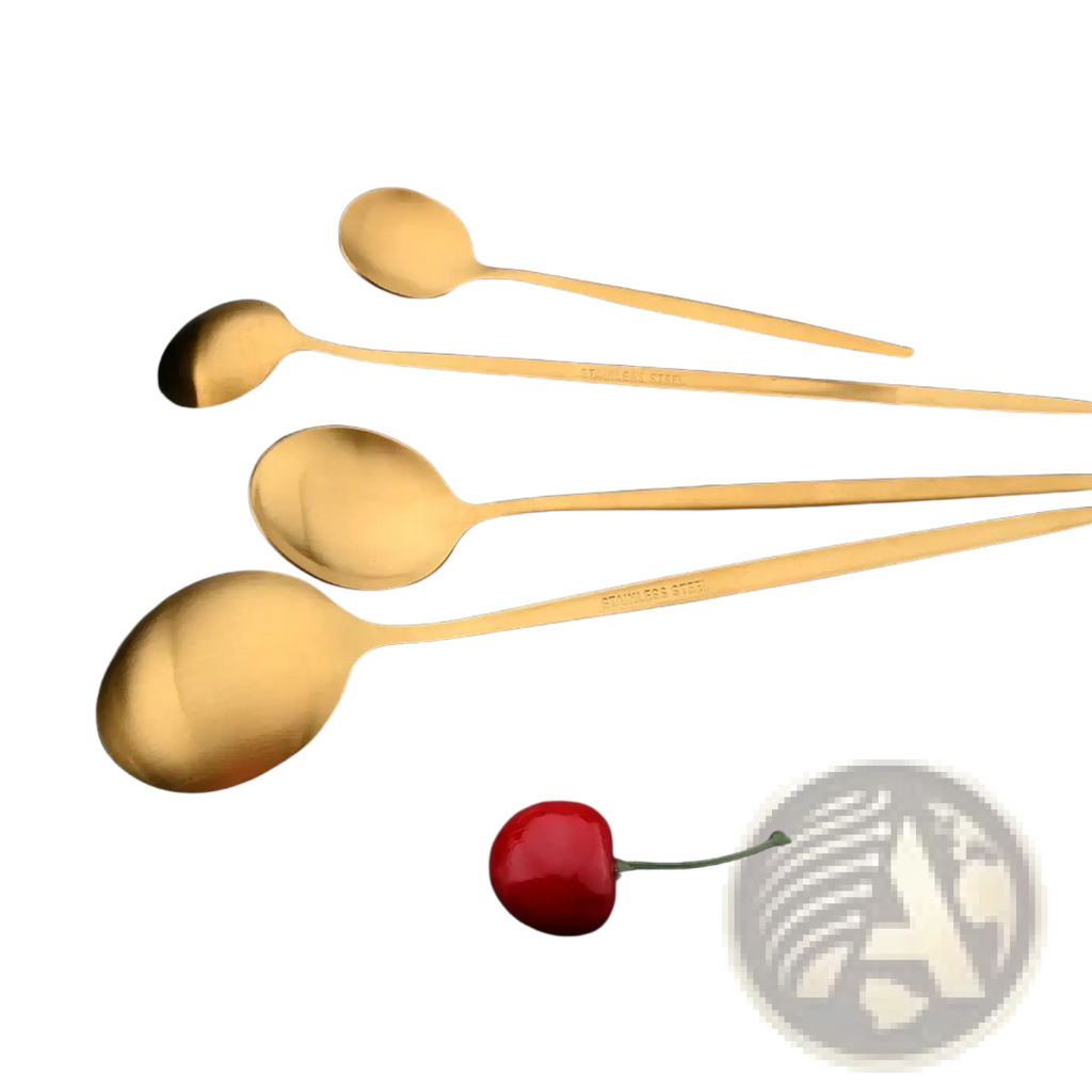 Set of four gold-toned stainless steel spoons with matte finish and elongated handles arranged diagonally on dark surface