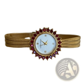 Gold mesh women watch with ruby bezel, gold-toned mesh bracelet, light blue dial, and quartz movement