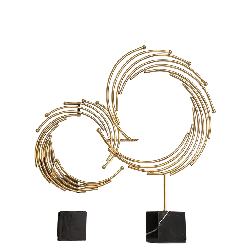 Gold metal abstract sculpture featuring golden metallic interlocking rings and spheres on a black marble base for office decor