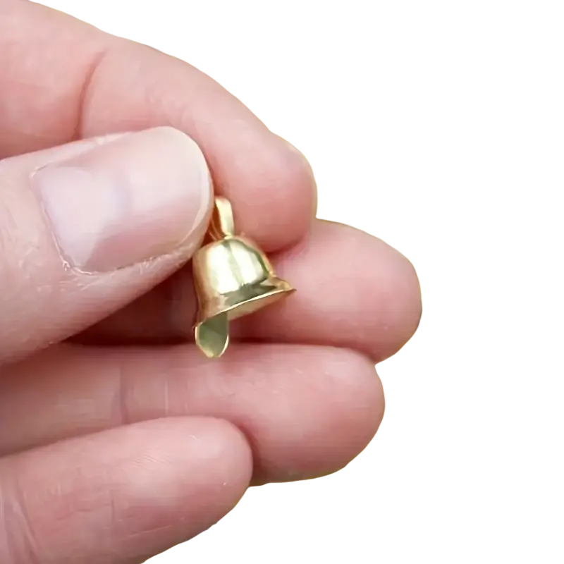A small shiny gold metal sleigh bell charm with a smooth finish and loop for attachment in a set of 20 pcs