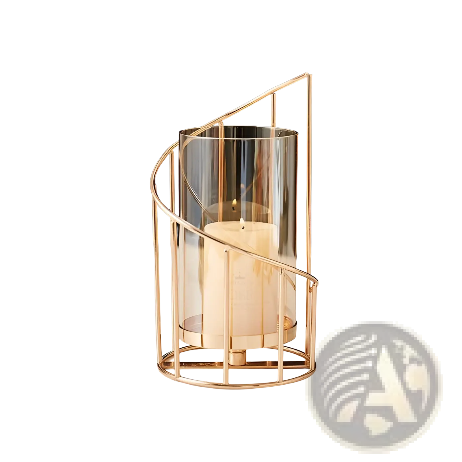 A gold metal spiral candle holder with a clear glass cylinder housing a white pillar candle