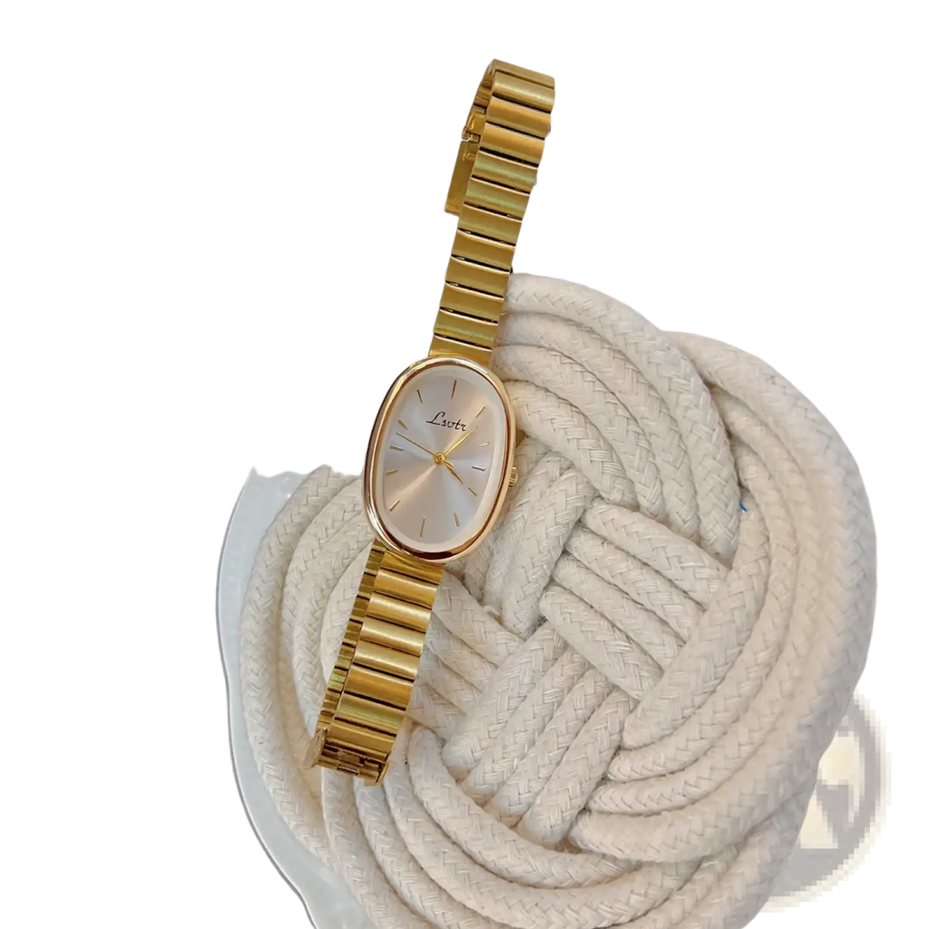 Gold minimalist oval quartz watch for women with gold-toned sleek metallic bracelet and a minimalist dial