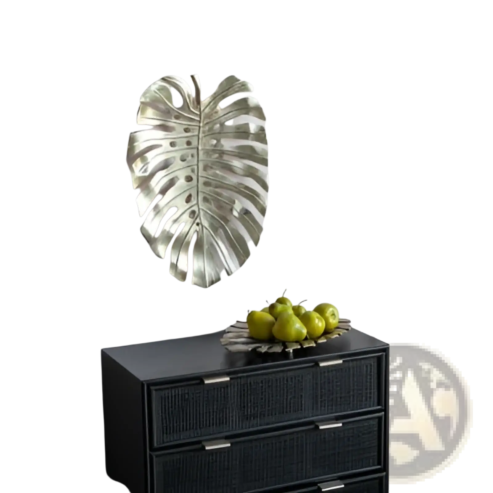 Silver metallic monstera leaf wall decor contrasting with the gold monstera leaf serving tray in a modern design