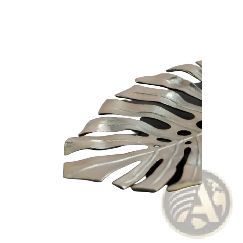 Silver-toned metal monstera leaf serving tray with sleek modern design featured in gold monstera leaf wall decor