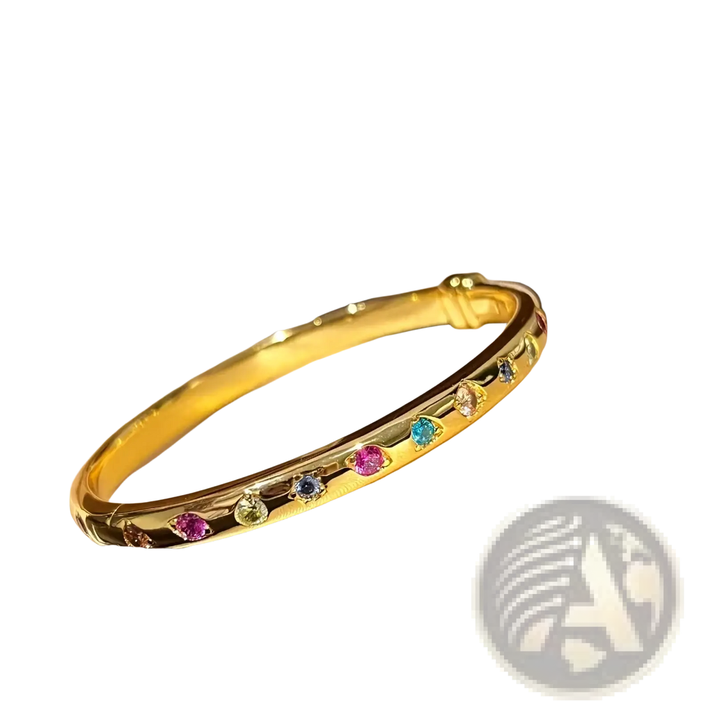 A gold multicolored gemstone bangle bracelet featuring round pink blue green and yellow stones in a row