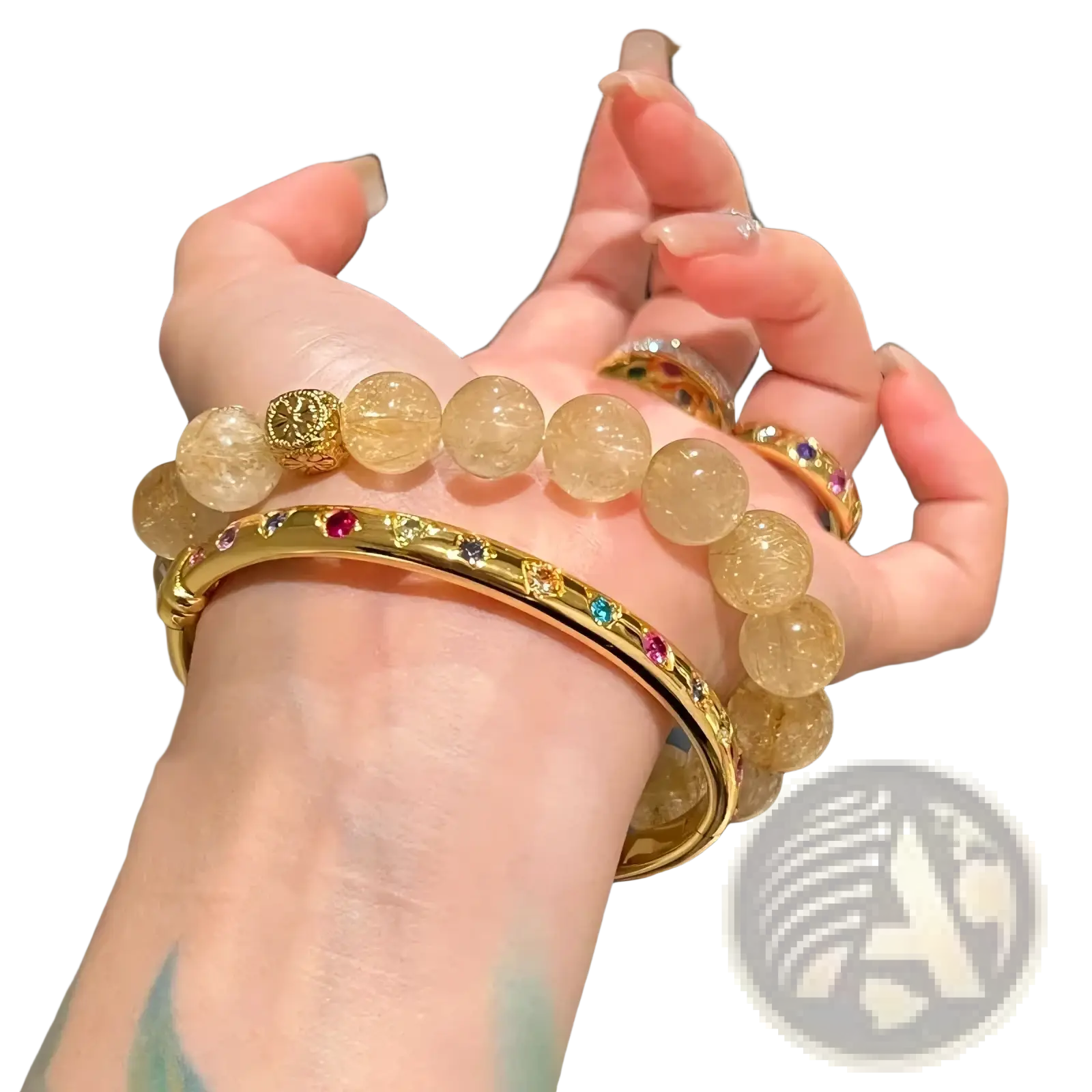 Gold multicolored gemstone bangle bracelet with gold-toned metal and a textured circular accent bead design