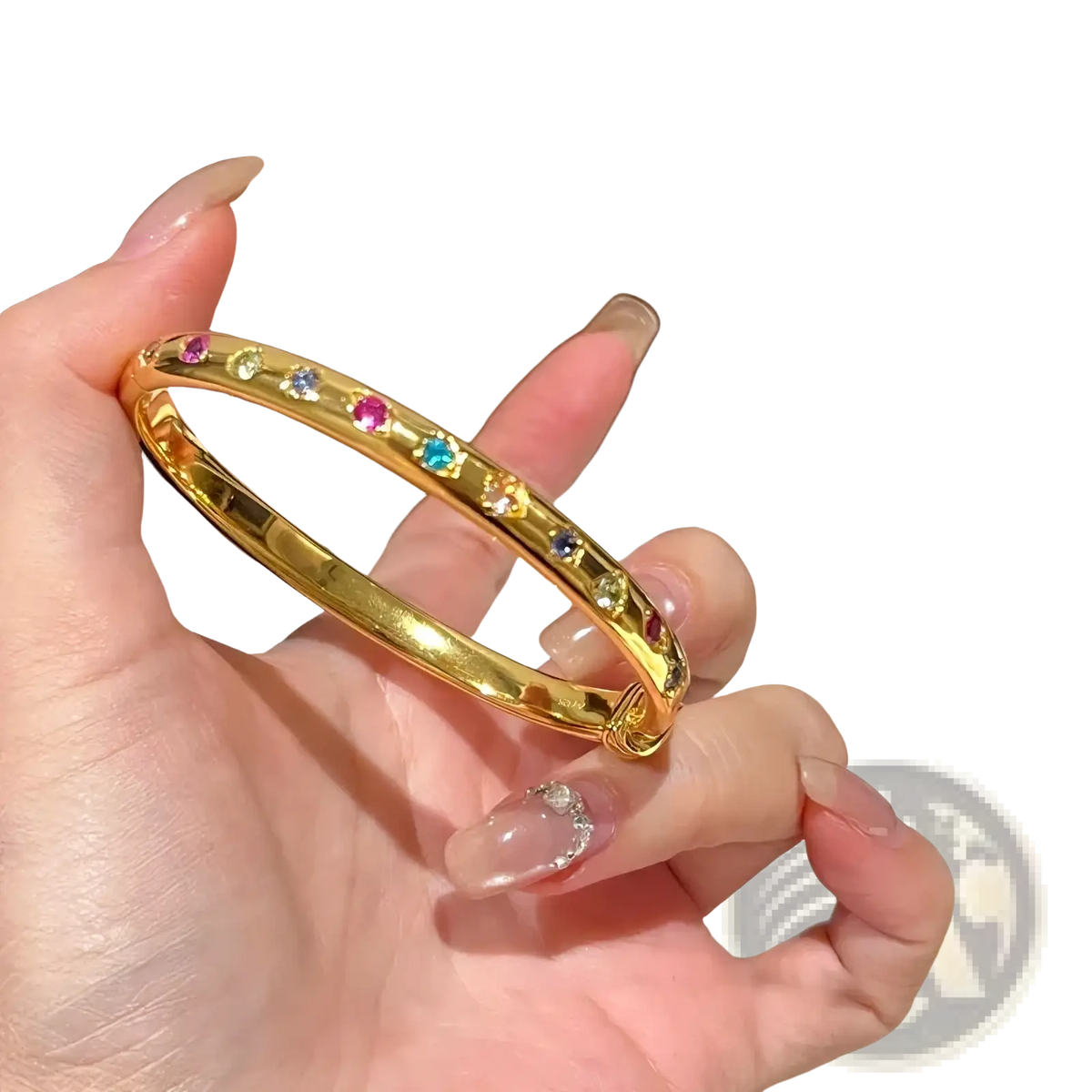 Gold multicolored gemstone bangle bracelet featuring a gold-toned band with vibrant multicolored gemstones in a continuous pattern