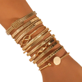 Gold multilayer open bangle set for women featuring gold-toned metal with intricate engraved and textured designs