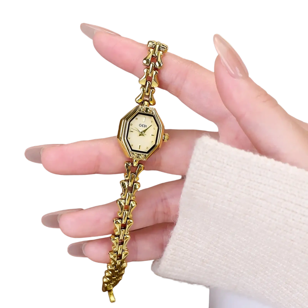 Gold-toned octagonal ladies quartz watch with cream dial and intricate gold chain-link luxury bracelet