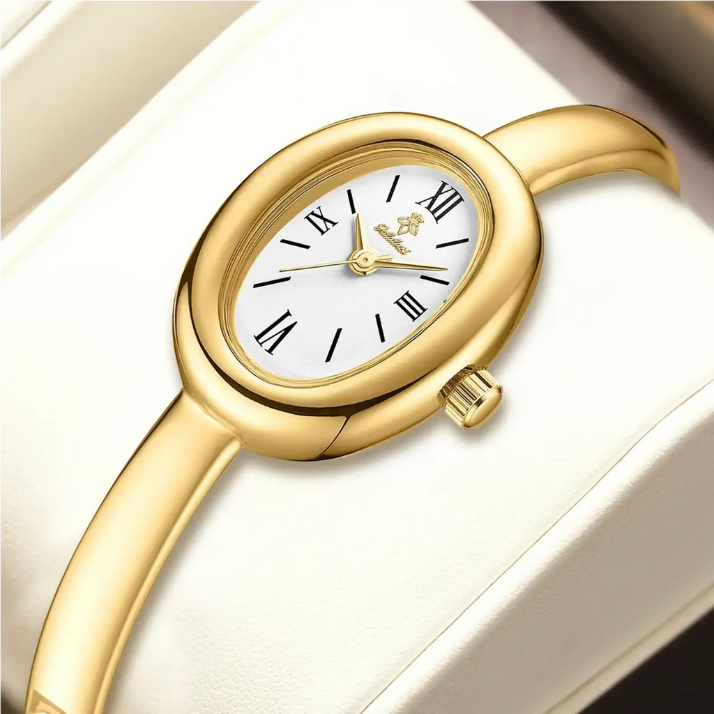Gold-toned oval women quartz watch with white dial black roman numerals and minimalist bracelet design
