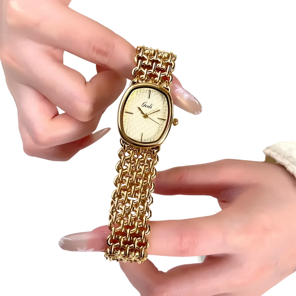 Gold-toned gedi oval women watch with cream textured dial and minimalist black hour markers elegant quartz bracelet timepiece