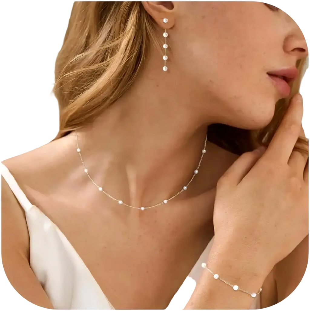 Delicate gold pearl jewelry set for women featuring a slender gold-toned chain with small white pearls evenly spaced