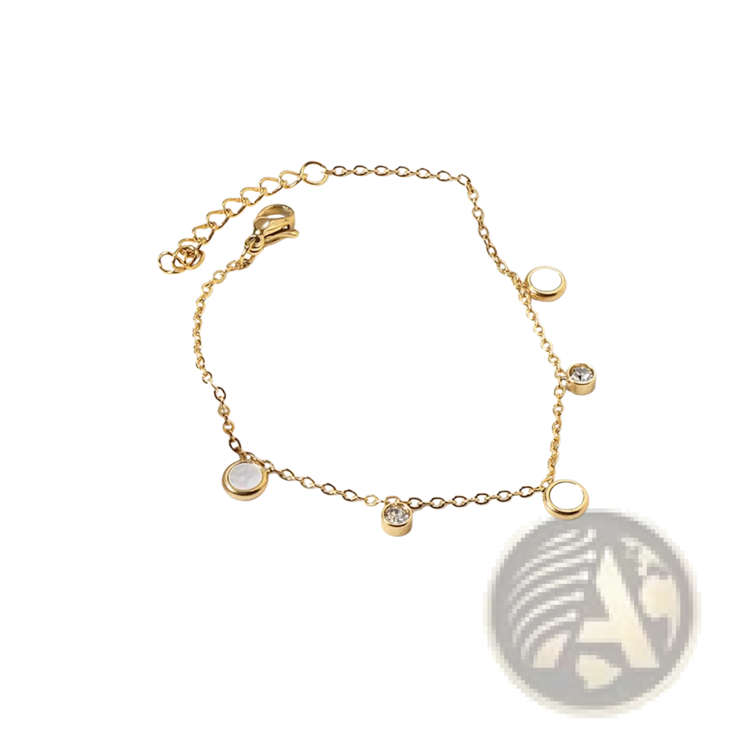Gold plated charm bracelet with crystal accents featuring gold-toned chain and alternating clear crystal and opal-like charms