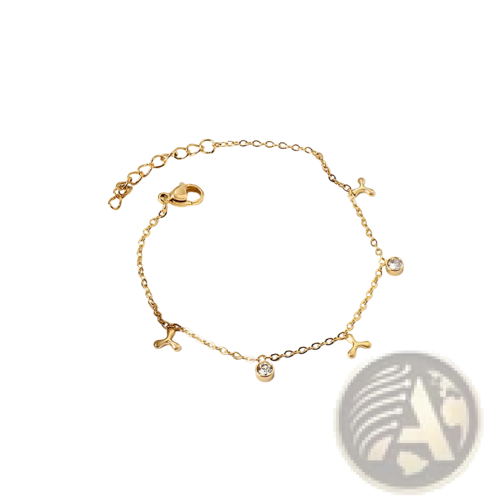 Gold plated charm bracelet featuring gold-toned chain with small three-pronged charms and clear crystal accents