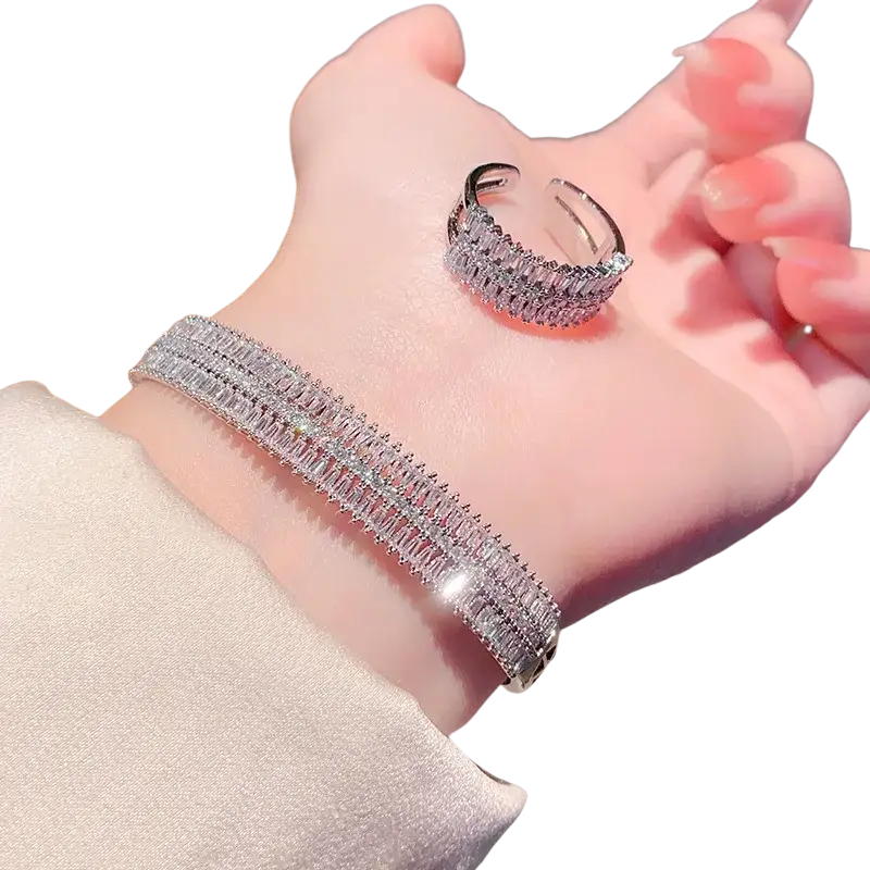 Silver-toned bracelet and matching ring set with multiple rows of sparkling baguette-cut crystals in a gold plated design