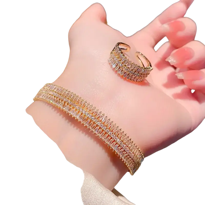 Gold plated crystal bangle bracelet and ring set in gold tone with multiple rows of sparkling baguette crystals