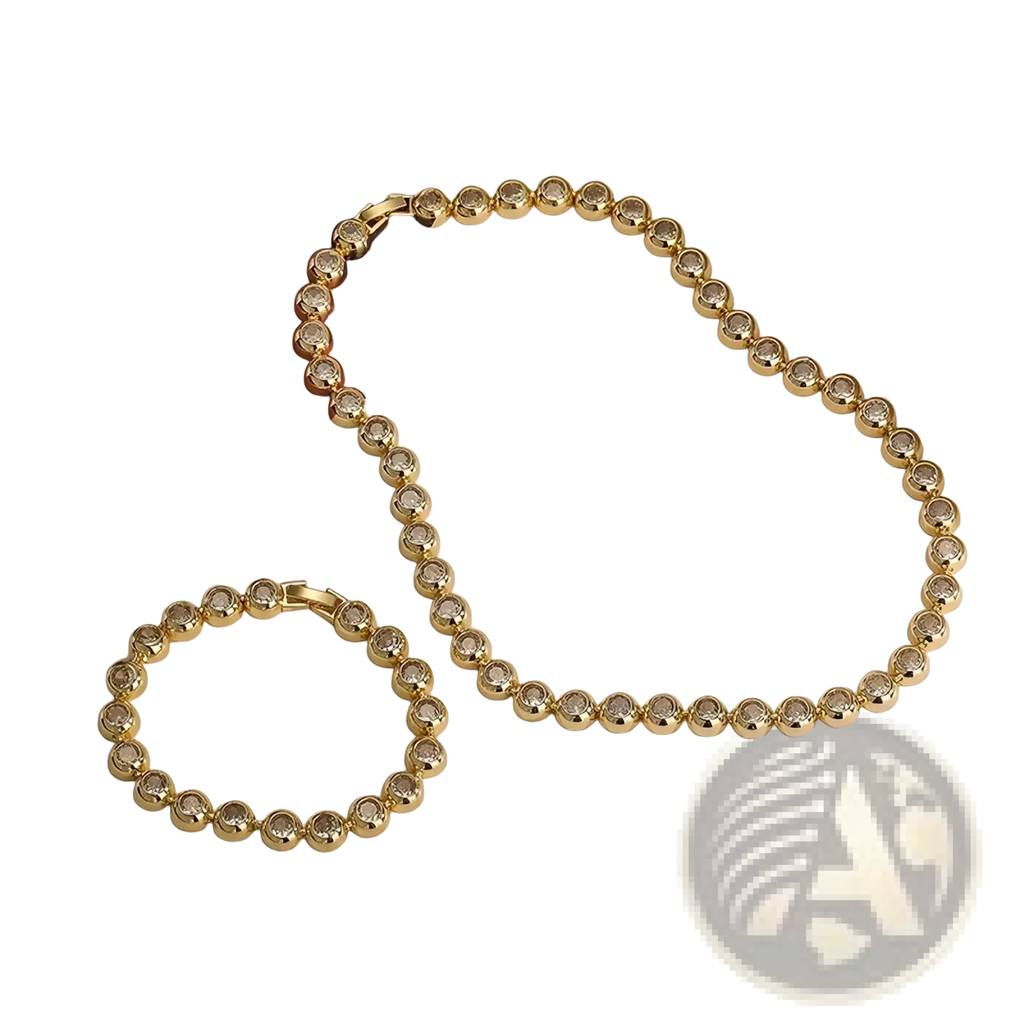 Gold plated cz tennis jewelry set featuring gold-toned beaded necklace and matching bracelet with faceted clear stones