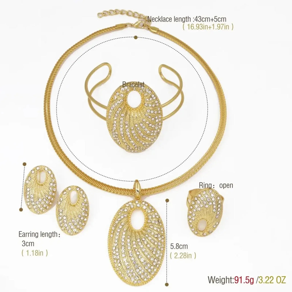 Gold plated rhinestone bridal jewelry set featuring an ornate gold-toned oval pendant with feather-like patterns