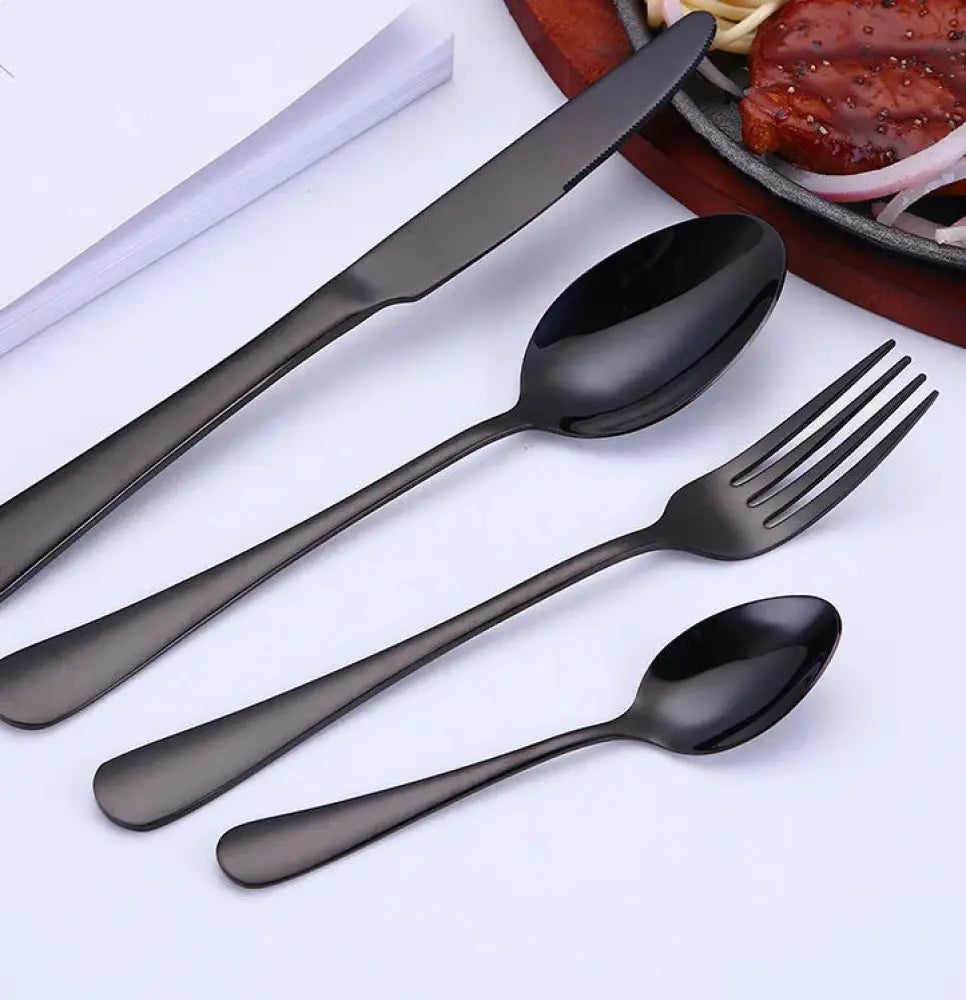 Luxury gold-plated stainless steel steak cutlery set with black matte finish and modern minimalist polished bowls